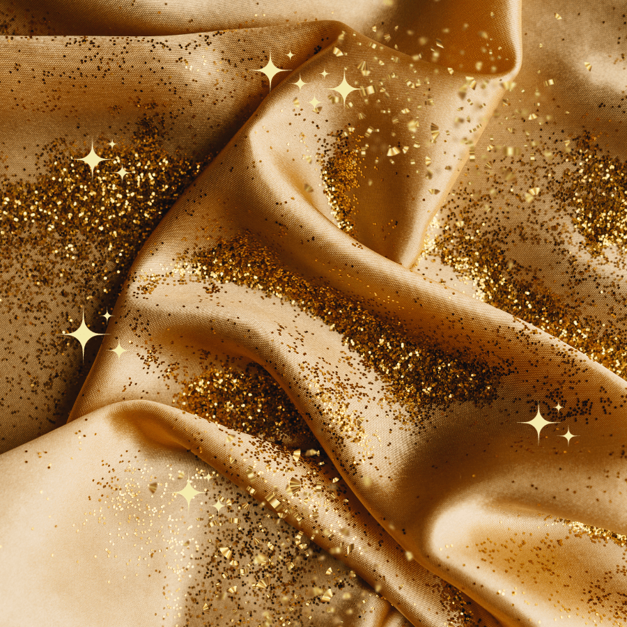 Golden fabric with glitter and sequins, festive look.