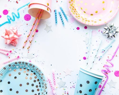 Birthday decorations. Table setting from above with free text space. Flat lay, top view